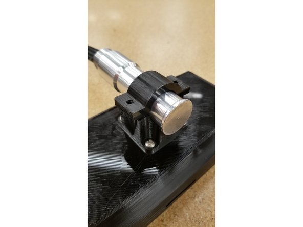 Use the mounting post clamp and two #6 1/2&quot; L sheet metal screws to cage the mounting post in position.