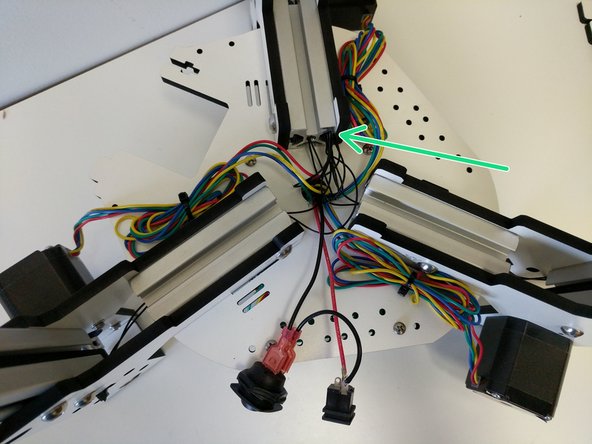 Pull the excess stepper motor wires up through the hole in the base of the printer. Be sure not to pull so hard to put strain on or damage the wires or Mini-RAMBo connectors.