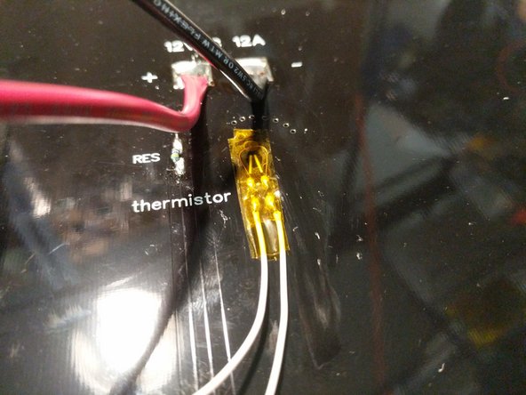 Solder the thermistor leads to the pads where indicated. There is not polarity so either wire on either pad will work. Since these pads are smaller, you want to be sure not to heat them too hot for too long or the pad can detach from the board.