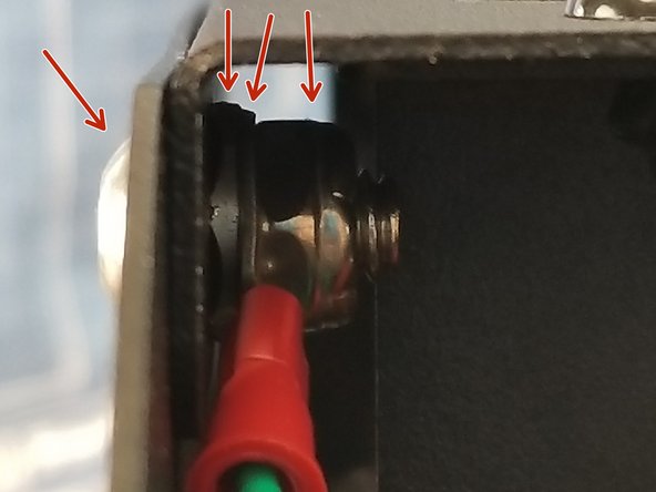 Using a thin lock nut, tighten the screw to clamp the spike washer down and secure the ring terminal to the washer. See Pic 3.  The order should be button cap screw through sheet metal, spike washer with spikes facing sheet metal, ring terminal, and finally secured by the thin lock nut.
