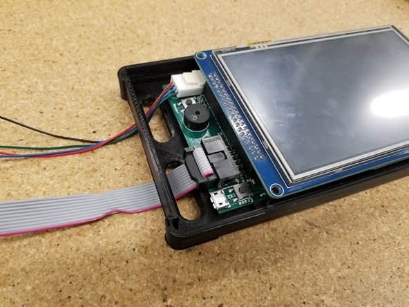Pass the cables through the holes in the back plate of the bezel you printed earlier.