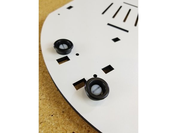 The feet are attached using the included plastic nuts and bolts. These fasteners are packed with the feet.