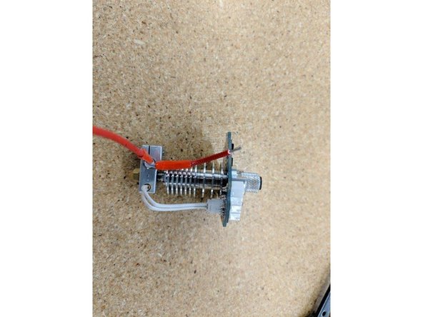 Strip ~4mm of insulation from the lead you just trimmed.