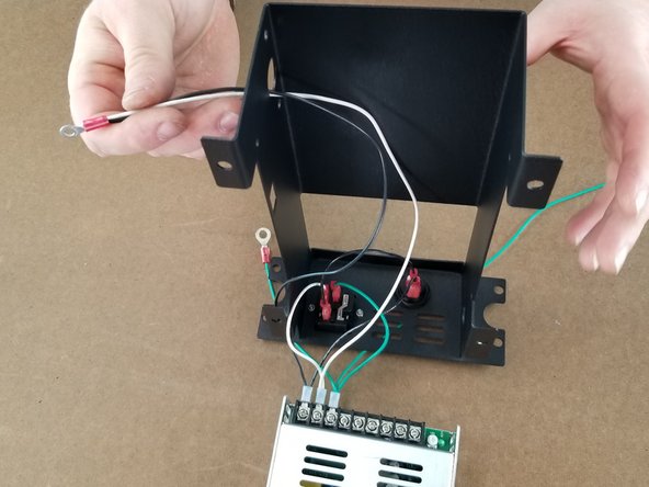 Route the long green wire out the hole on the front side as shown in Pic 3.