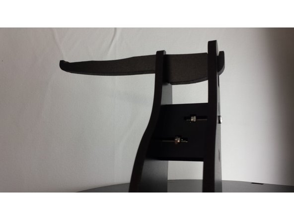 Install the spool holder arms as shown in the image.