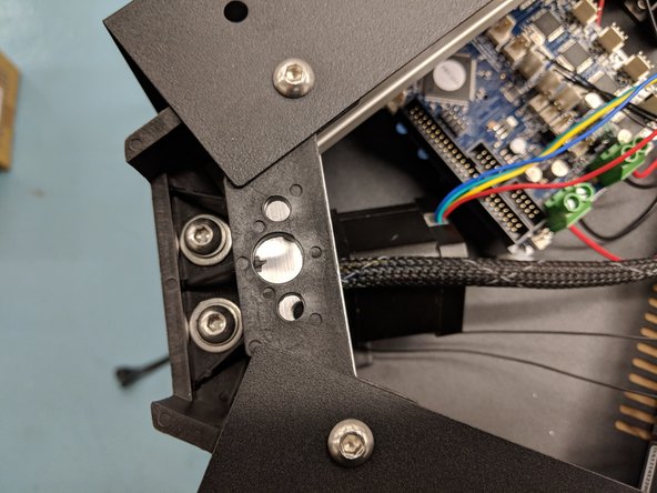 Secure the tower in place by reinstalling the 1/4-20 x 1&quot; long button head screws, split ring washer, and flat washer stacked the same as you removed them.