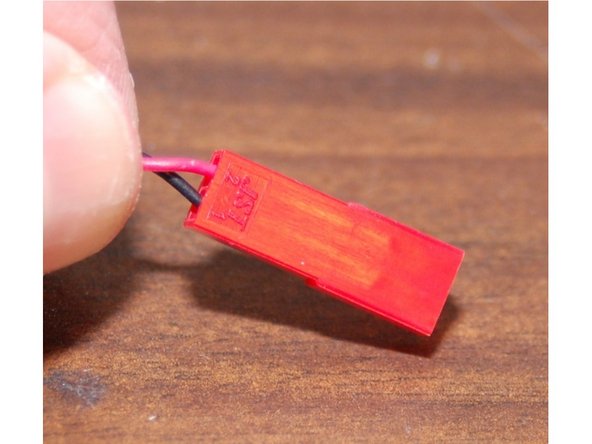 Grab a pair of male JST connector pins and crimp them on to the Layer fan leads.