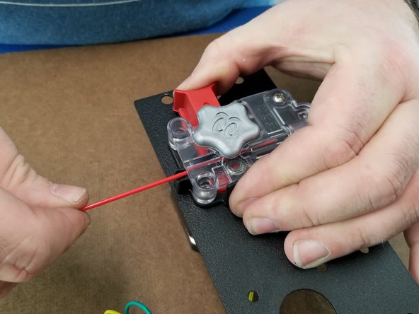 Release the red lever and make sure the filament is being held tightly by the hobbed gear.