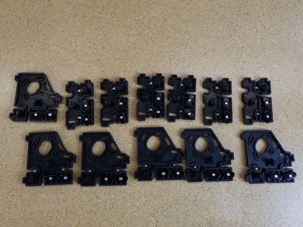 Insert the 6-32 nylon lock nuts into the injection molded parts first. There will be 2 of these nuts inserted per injection molded piece.