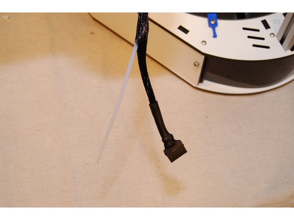 The PTFE will enter the mesh loom approximately 90mm below the extruder. Open a gap in the mesh by pressing two areas about 1&quot; apart toward each other. This will expand the loom.