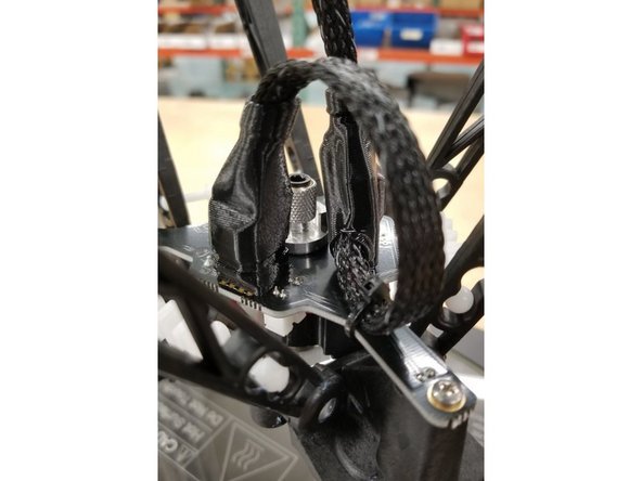 Cover the plugs with the rubber boots.