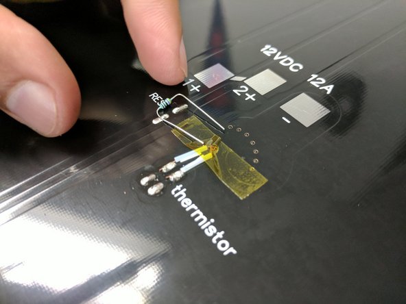 Place a piece of Kapton tape over the thermistor leads to protect them.