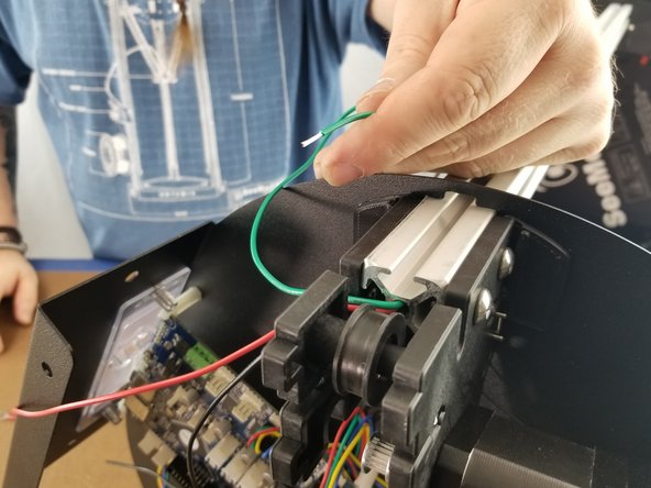 Bend the wires coming from the extrusion out the slot in the bracket as shown in Pic 1.