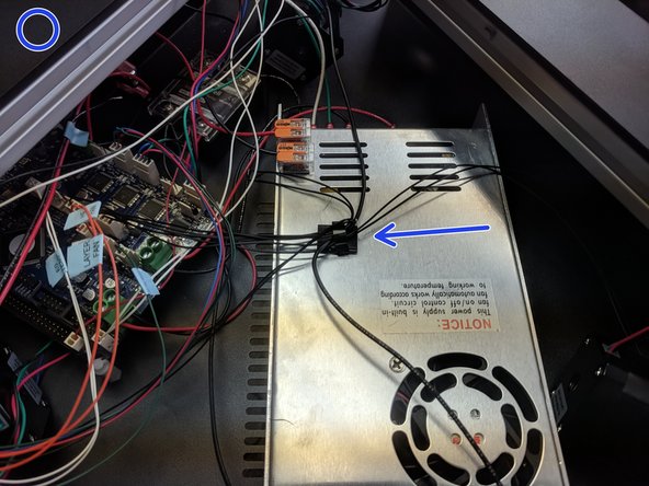 Install a wire clamp on the top of the power supply in a location similar to the image. (Your machine may already have this installed)