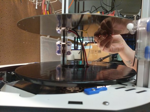 Align the heated bed with the with the bed insulator. There is a pocket for the thermistor on the insulator and there are 3 dimples (align with holes in the periphery of the heated bed) that will help you align the bed with the insulator.