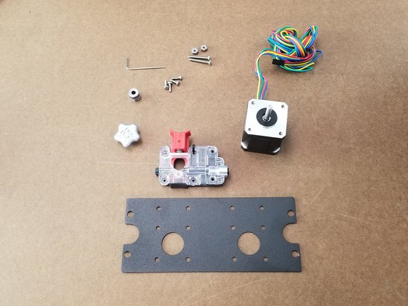 Here we will be installing the extruder to the mounting plate.  You will use the final remaining motor, the ezr struder body, the silver ezr knob, hobbed drive roller, allen key, 4x M3x10mm long screws, 2x 6-32 x 7/8&quot; long phillips screws and 2x 6-32 nylon insert lock nuts.