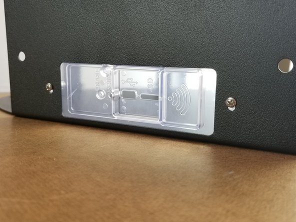 Slide the panel cover to the top of the slotted holes on the sheet metal and tighten.  The screws thread directly into the plastic of the Duet Panel Cover.