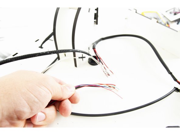 You can see here in the picture that we have a bundle of 8 wires from the new hotend whip and 8 wires from the exiting wiring.  In the following steps we are going to work on getting these connected.