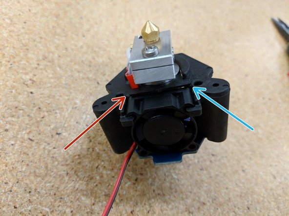 Install with the long leg of the blocker on the left (red arrow) and the short leg of the blocker on the right (blue arrow).  You'll feel the blocker &quot;snap&quot; into place when it's properly seated.