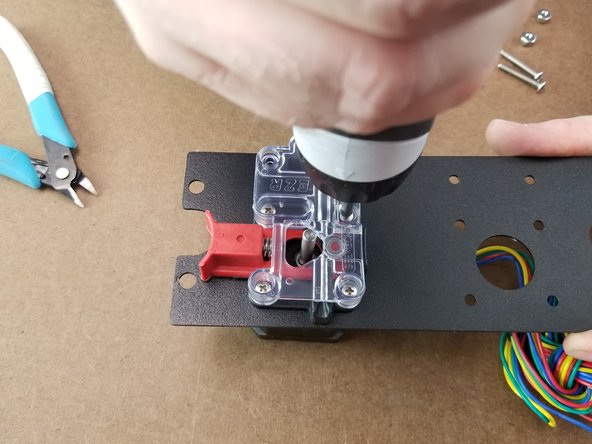 When all 4 screws are snug, as seen in Pic 3, apply pressure to the red lever on the ezr struder.