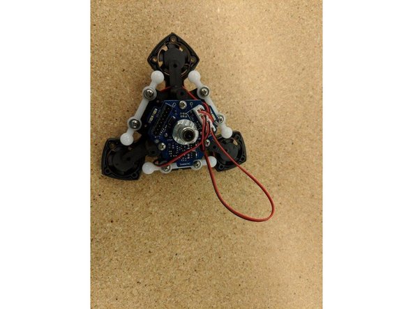 Take the large loop of fan wire, fold it in half and carefully spindle it as shown.