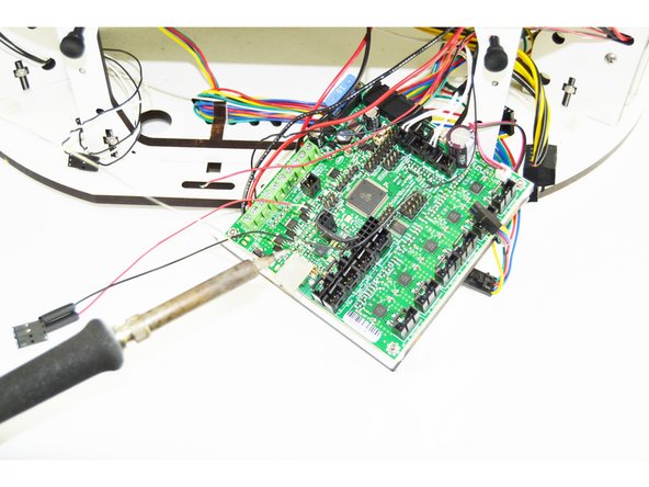 Slide a 15mm long heat-shrink tubing over the red wire that is in the 4 pin latching housing. (as shown in the picture)