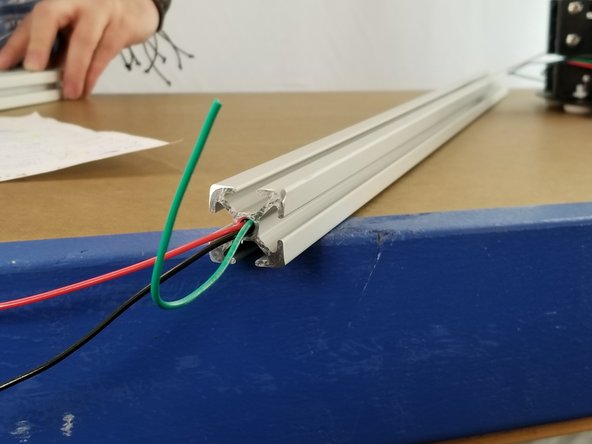 You will have 3 wires coming from the power supply out the same side hole in the front of the power supply.  One red, one black, and one green.