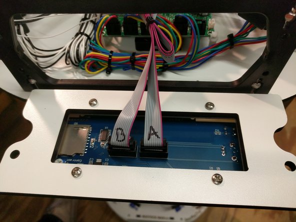 Locate and install the ribbon cables on the LCD. If they are not already labeled do so now (to match the image)