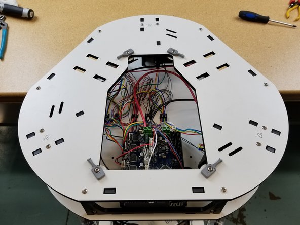 Install the top plate the same way the other main frame plates have been installed, using the 6/32 1&quot; bolts and captive nylon lock nuts in the motor and side panel plastics.