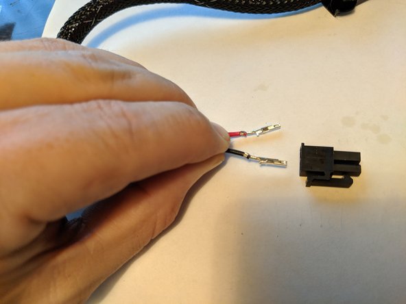 We will now get the black connector for the power plug and install the wires into this plug.  If you look carefully at Pic 1, I am holding the wires the way they will insert into the plug.