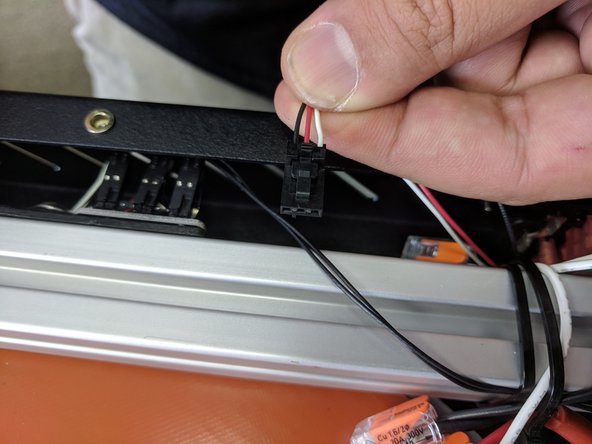 Install the 3 pin connector on the John SL Probe board. This is the hardest component to install on the entire machine. We apologize for its inconvenience, but the board being positioned here will allow the user to see the LEDs indicating probe strikes.