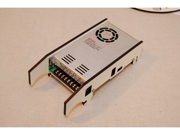 WARNING: Don’t forget the washers in this step! The 1mm spacing they provide prevents the screws from contacting electrical components on the inside of the PSU. Failure to include these washers can cause the PSU to fail.