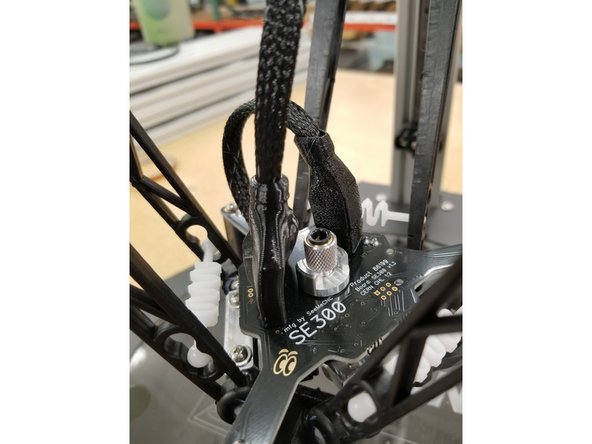 Slide the boots in to place, routing the whip extension through the opening in the back of the 10 pin boot as shown.