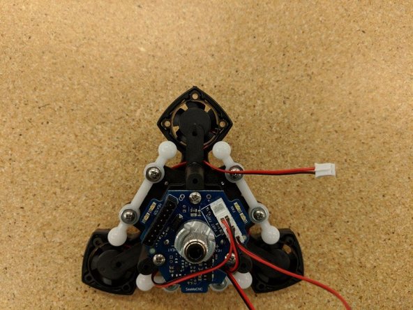 As you connect each fan wire, route the wire as shown in the photos.