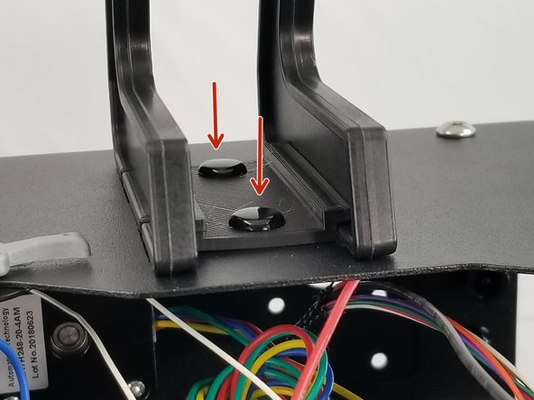 Insert the spool holder in the top plate and slide it towards the outside of the machine.