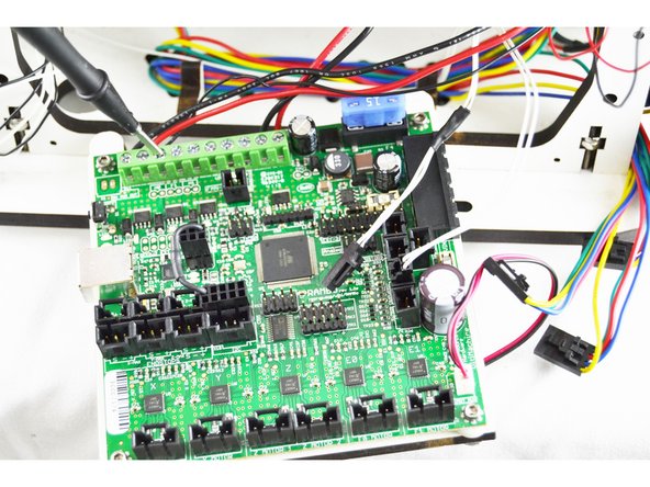 To start determine which of the wires is connected to the Fan 0 - location on the RAMBo board. Use your multimeter for this determination. After you have determined which of the existing wires it is, label the wire Layer Fan/Orange. (I used a post it note shown in step 27 to label the wires)