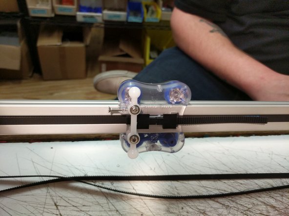 Be sure that the belt is not routed on the outside of the frame or carriage pieces! This will prevent motion.