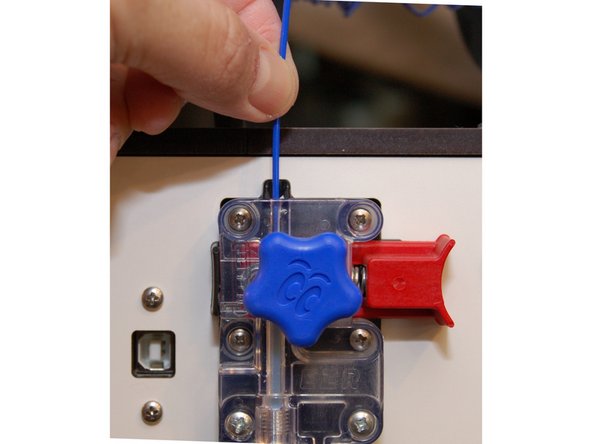 Insert the new filament into the top of the extruder until it stops.