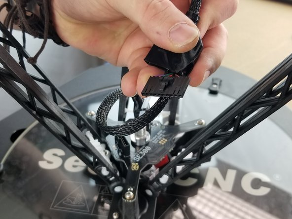 Slide the boot up the rectangle 10 pin plug as shown in Pic 1 to expose the clip.