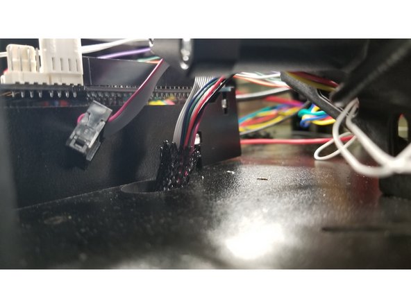 Pass the cables through the hole to the right of the Duet board.