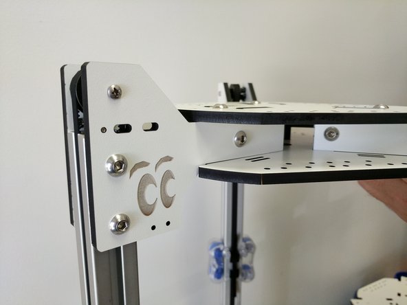 In this step and all other steps using the TSLOT nuts, the boss (ridge) on the nut should be facing away from the head of the button head screw.