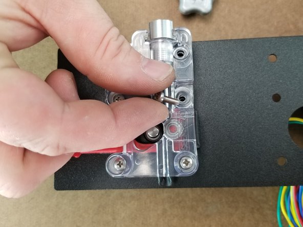 Insert the 4x M3x10mm long phillips screws through the ezr struder into the motor.  Tighten these screws snug but do not fully tighten yet.