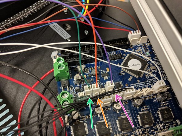 The green, orange, and purple wires exiting the X tower bundle connect to the locations shown in the photos.