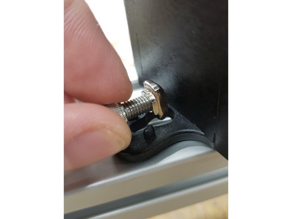 Carefully push the wire into the machine until the assembly can lay flat.