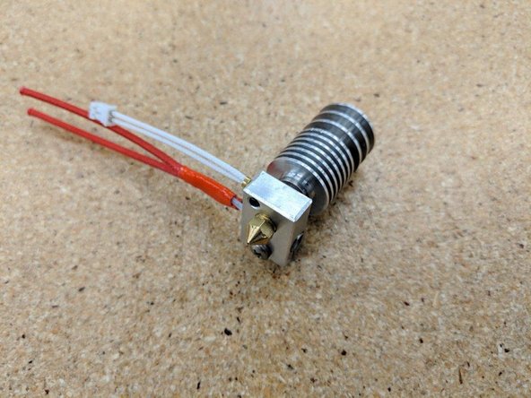 Screw the heat break and heatsink into the heater block watching the threads of the heat break until the end of the threads are just about even with the the heater block.