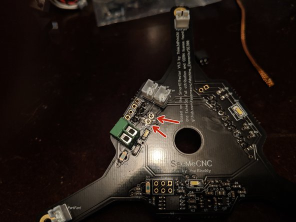 Pic 1 shows the under side of the board with the new plug installed.  You can see the legs of the new power connector sticking through the board.