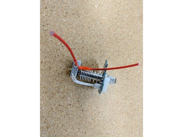 Trim one heater cartridge wire so that it extends past the top of the PCB by about 6mm as shown in the photos.