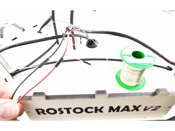 Slide the heat-shrink up over the connection that you soldered and heat it with a lighter.