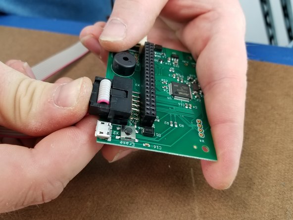 Which end of the ribbon cable doesn't really matter here, but generally the end shown in the photos is easier to install on the control board side because of the direction the cable exits the black terminal.
