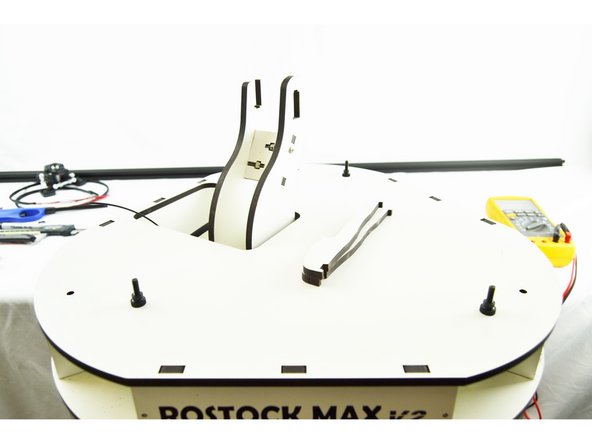 Remove the three thumb screws that fasten the top plate to the rest of the printer.